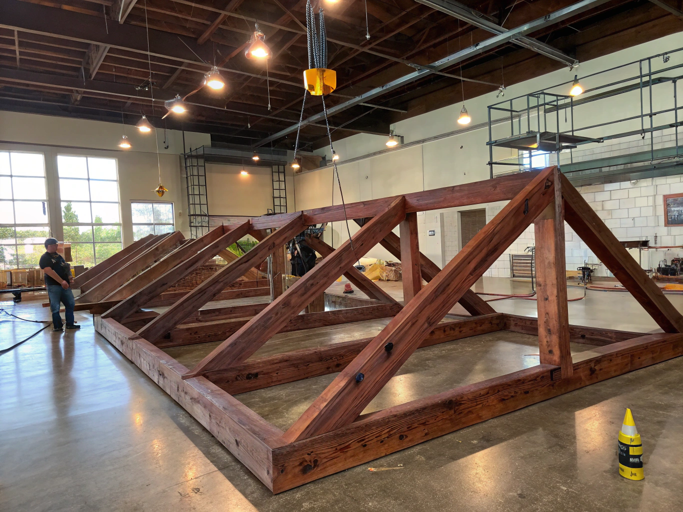 Engineered post frame wood trusses creating large clear span interior space
