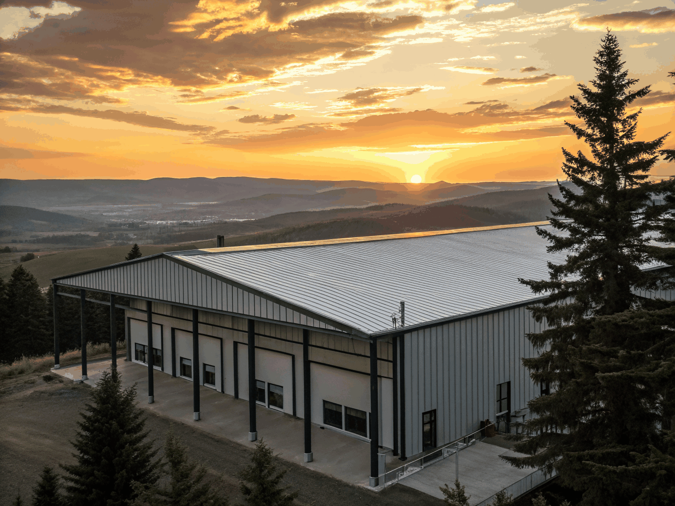 Framelogic engineered post-frame timber structure against Midwestern sky